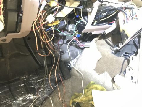 1996 Ford Bronco - Exposed wiring harness under the dashboard of a 1996 Ford Bronco.