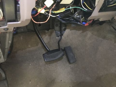1996 Ford Bronco - The complex wiring harness is visible above the pedals in this vehicle's interior.