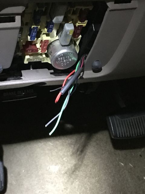 1996 Ford Bronco - Exposed wiring and fuse box components are visible inside the vehicle's interior.