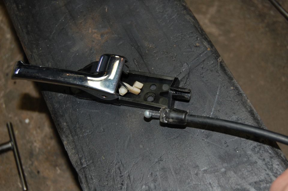 Chrome door handle mechanism and cable assembly, possibly for an older car