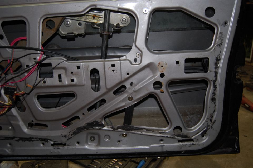 1985 Mercury Grand Marquis door interior frame with wiring and window mechanism visible