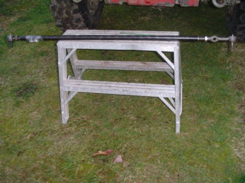 1993 Ford Bronco - A steering linkage is displayed on a sawhorse in a grassy area.
