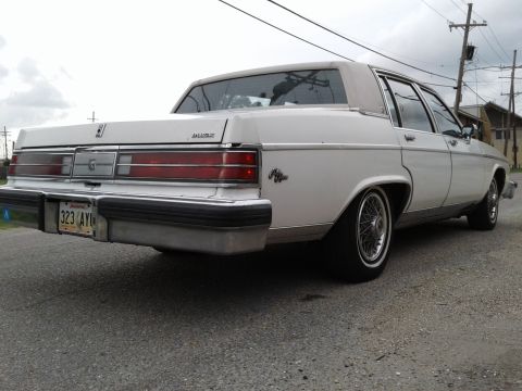 1984 Buick Electra - This sedan features a chrome bumper and horizontal taillights.