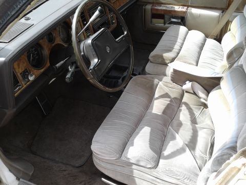1984 Buick Electra - Interior view of a 1984 Buick Electra, its plush velour seating and classic dashboard design.