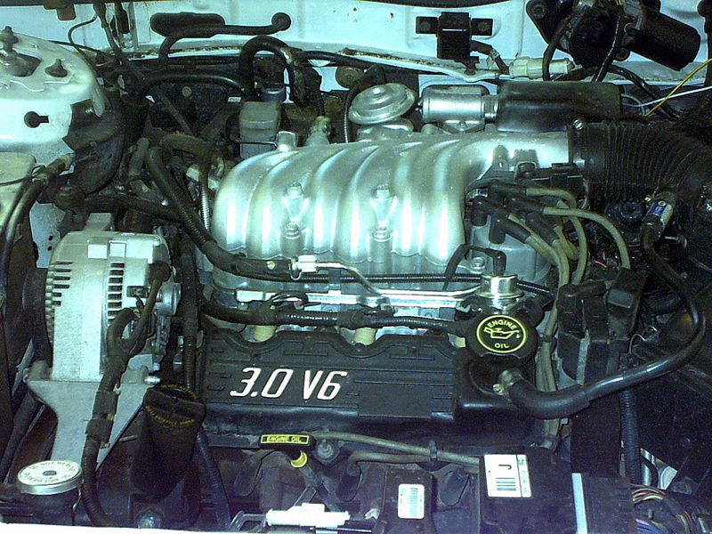 Ford 3.0 V6 engine bay with silver intake manifold and black valve cover