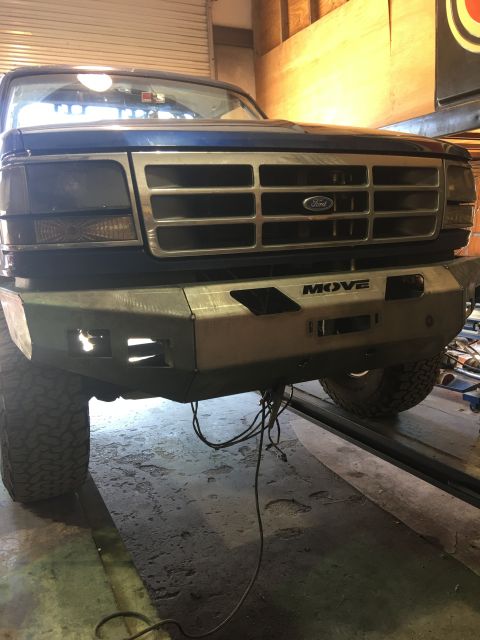 1996 Ford Bronco - Front view of a 1996 Ford Bronco, a custom "MOVE" bumper and the iconic Ford grille.