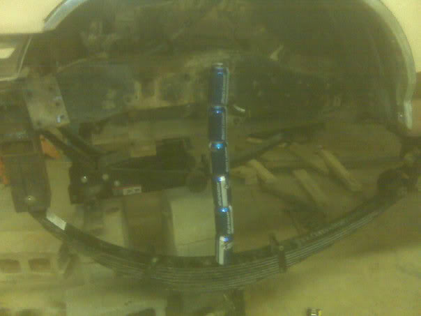 Leaf spring assembly with stacked cans for scale