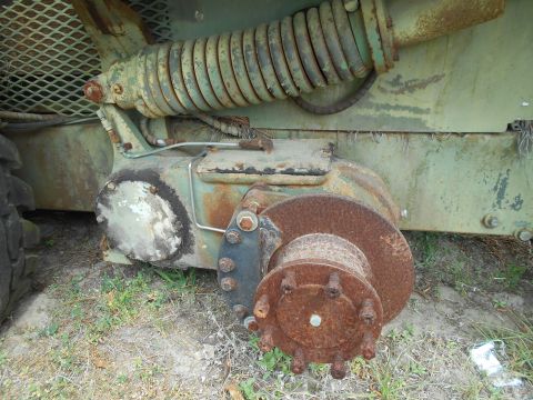 1992 Ford Bronco - Detail of a heavily rusted suspension part, likely from a large vehicle or piece of equipment.