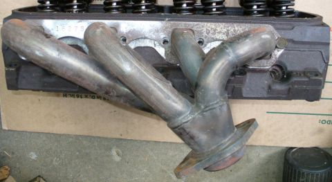 1992 Ford Bronco - Driver side JBA shorties on GT40P head. Only mildly difficult spark plug access.