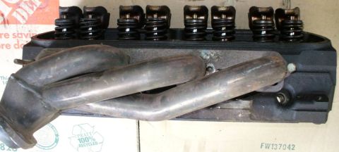 1992 Ford Bronco - Passenger side JBA shorties on GT40P head. Fairly difficult spark plug access. Probably requires short plugs & socket. May not have room fo…