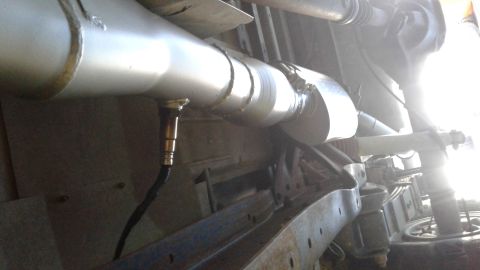 1985 Ford Bronco - Underside view of a vehicle's exhaust system, showing an oxygen sensor.