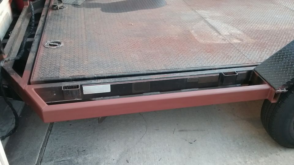 trailer deck with diamond plate surface and red frame