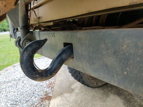 1988 Ford Bronco - Close-up of a heavy-duty tow hook attached to a vehicle's rear bumper.