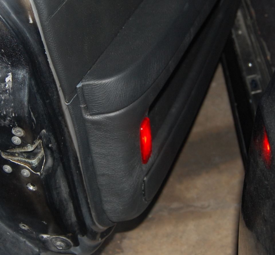 Interior door panel with red reflector light