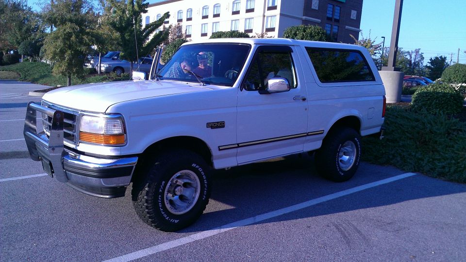 White 1995 Ford Bronco parked in a lot