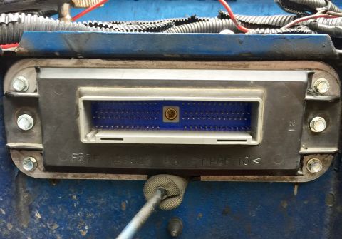 1974 Ford Bronco - Automotive ECU connector with visible part numbers and material markings.