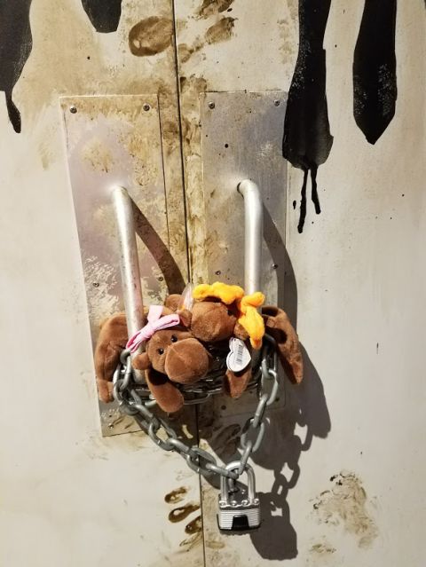 1978 Ford Bronco - Stuffed animals are chained to a door with a padlock.