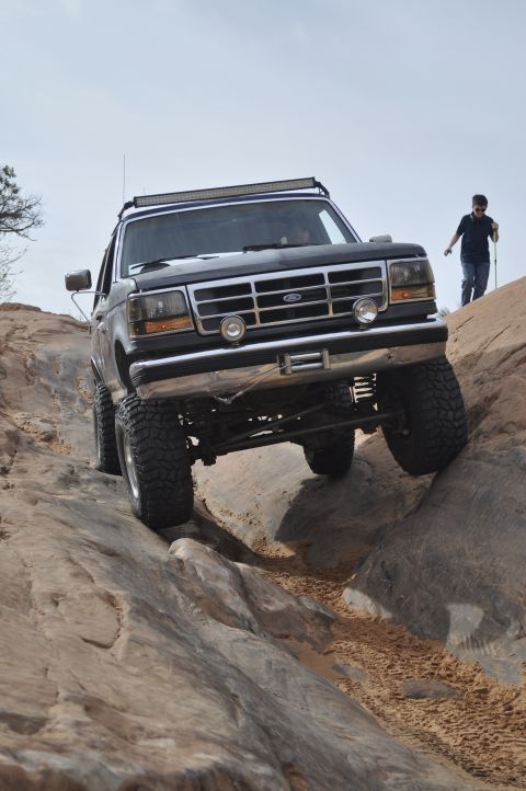 1991 Ford Bronco - This 1991 Ford Bronco is navigating a challenging off-road course on a rocky terrain.