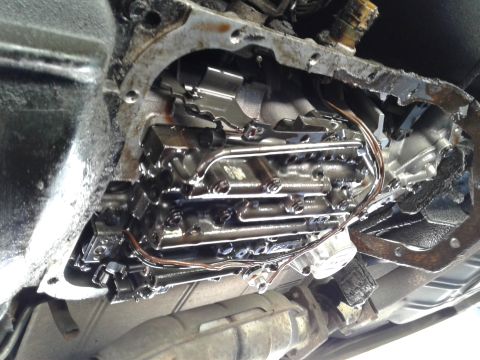 1984 Buick Electra - Automatic transmission valve body with visible wiring and metal components.