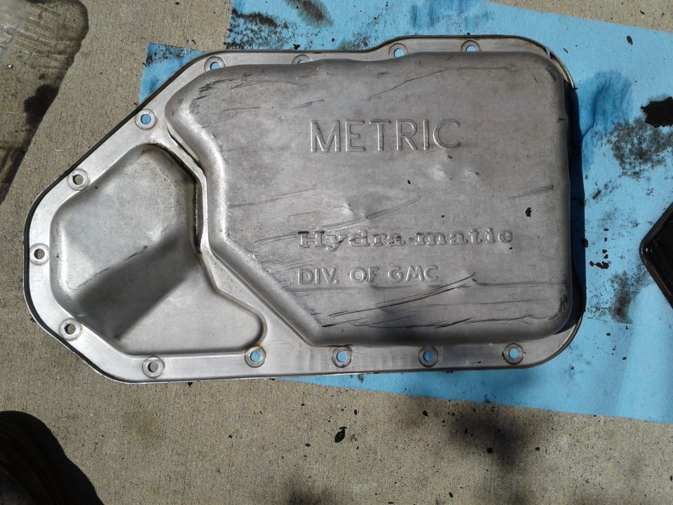 transmission pan with 'METRIC Hydra-matic DIV. OF GMC' stamped on it