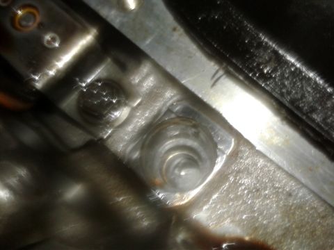 1984 Buick Electra - A detailed view of a mechanical part, showing fasteners and metallic texture.