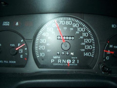 2001 Ford Crown Victoria - The dashboard shows a vehicle traveling at 60 mph with the check engine light illuminated.