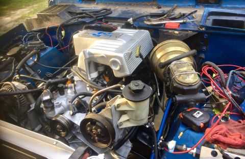 1974 Ford Bronco - Close-up view of a vehicle's engine bay, showing various components and wiring.