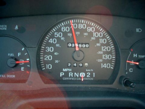 2001 Ford Crown Victoria - Dashboard gauges including speedometer, odometer, fuel, and temperature readings.