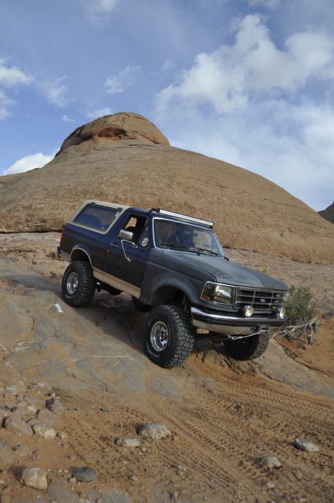 1991 Ford Bronco - This 1991 Ford Bronco navigates a challenging off-road course in a desert environment.