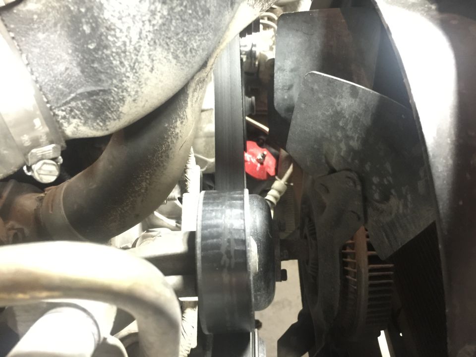 Serpentine belt and pulleys in a 1996 Ford Bronco engine bay.