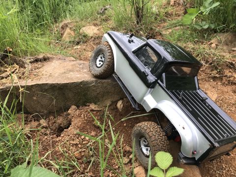 1989 Ford Bronco - This remote-controlled truck is navigating a rocky, off-road course.