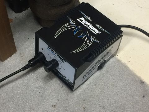 1989 Ford Bronco - TrakPower TK-950 battery charger for RC speed equipment is shown with cables connected.