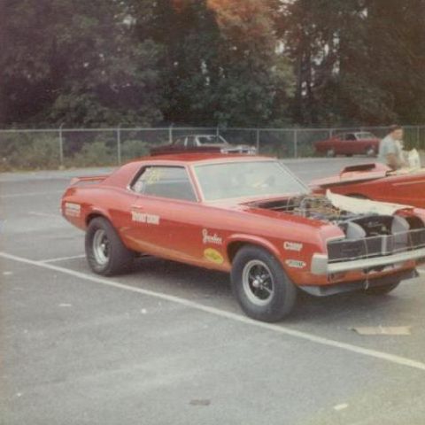 1968 Mercury Cougar - This vintage Mercury Cougar is set up for drag racing, with its hood open revealing the engine.