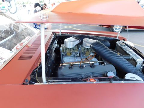 1968 Mercury Cougar - The open hood reveals a powerful engine with prominent dual carburetors and custom intake piping.