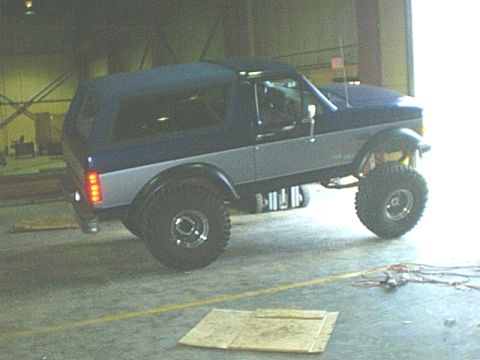 1995 Ford Bronco - This lifted Ford Bronco has a two-tone paint job and a removable soft top.