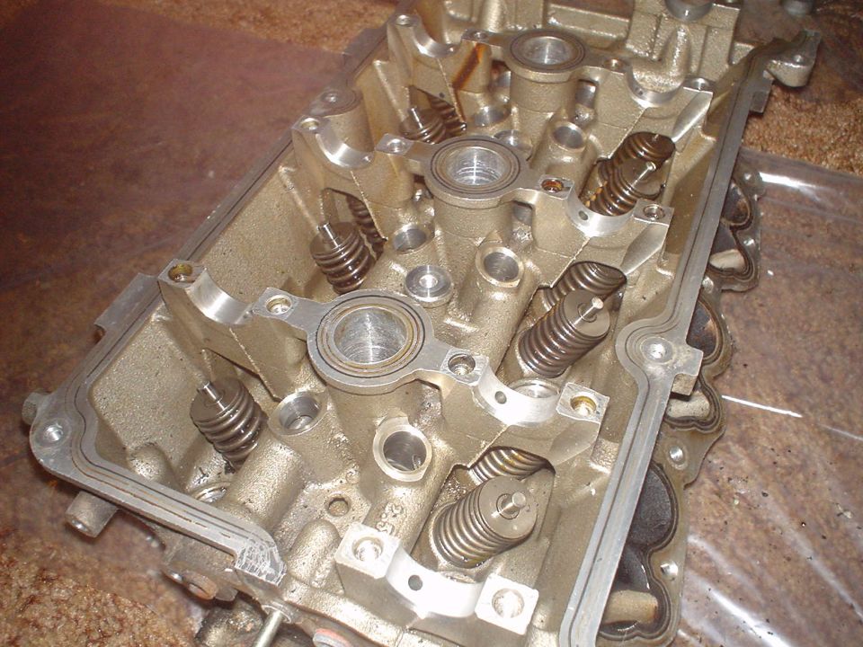 SVT heads being dissasembled. The Rocker arms and cams are removed.