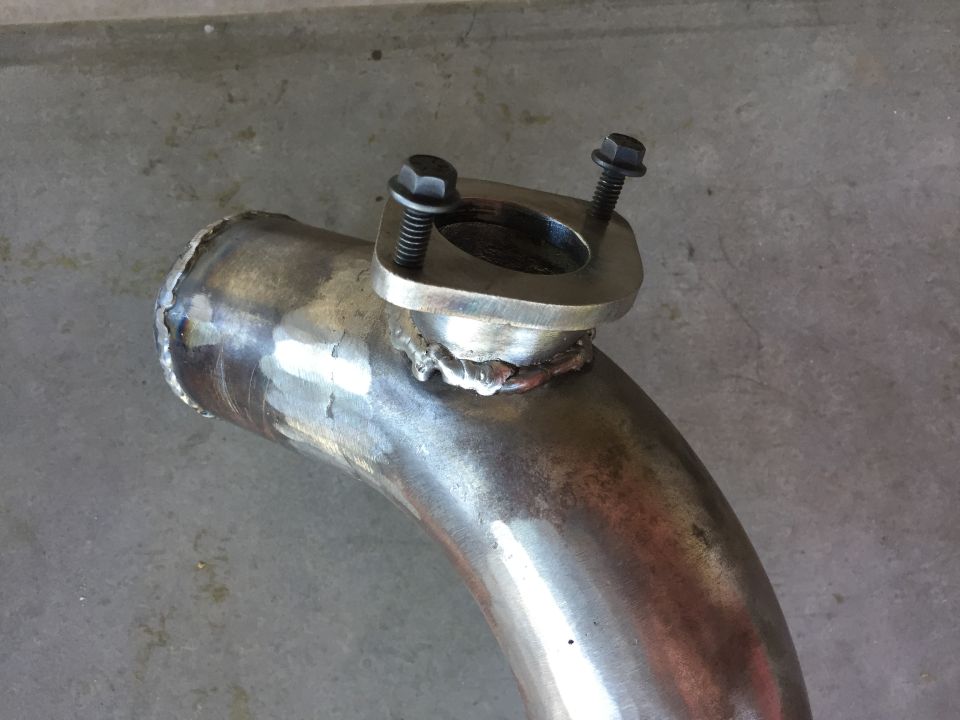 Working on the intercooler piping. This is the pipe to the throttle body with the blow off valve flange welded on. I decided to go with a Type R blow off valve off ebay for simplicity. It came with a nice 2.5" aluminum pipe and flange but I don't want to use two more silicone couplers just for the flange. I made this one out of 1/4" steel plate and some pipe. They have steel flanges on ebay but not with threaded holes. 1/4" plate is fine with 1/4-20 grade 8 flange bolts. I hate fumbling around with nuts and washers.