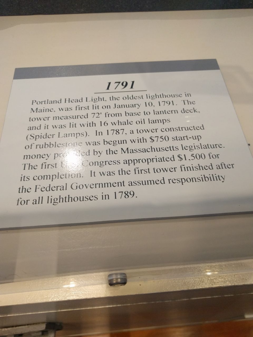 Sign detailing the history of the Portland Head Light, built in 1791.