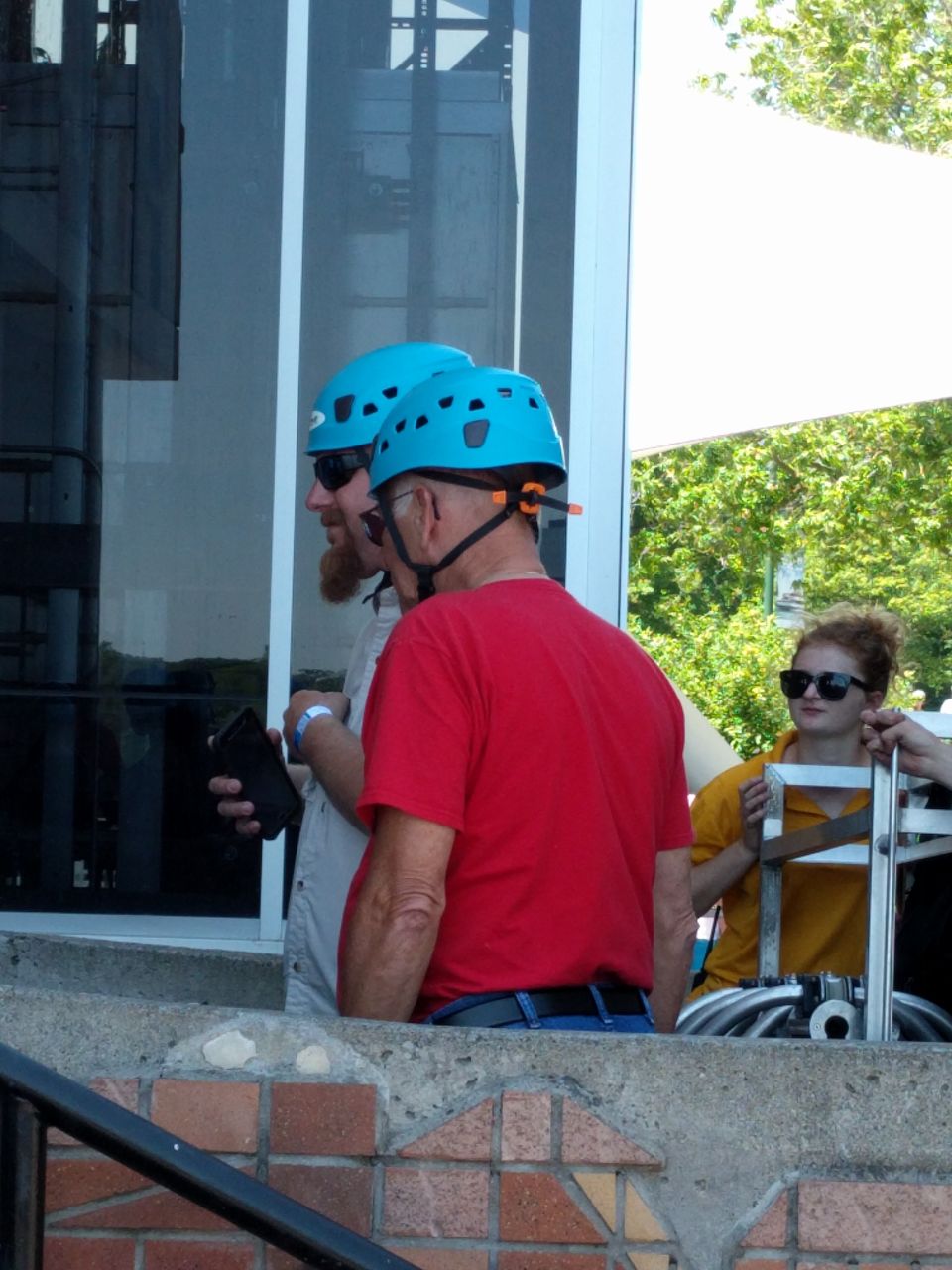 Two people wearing helmets