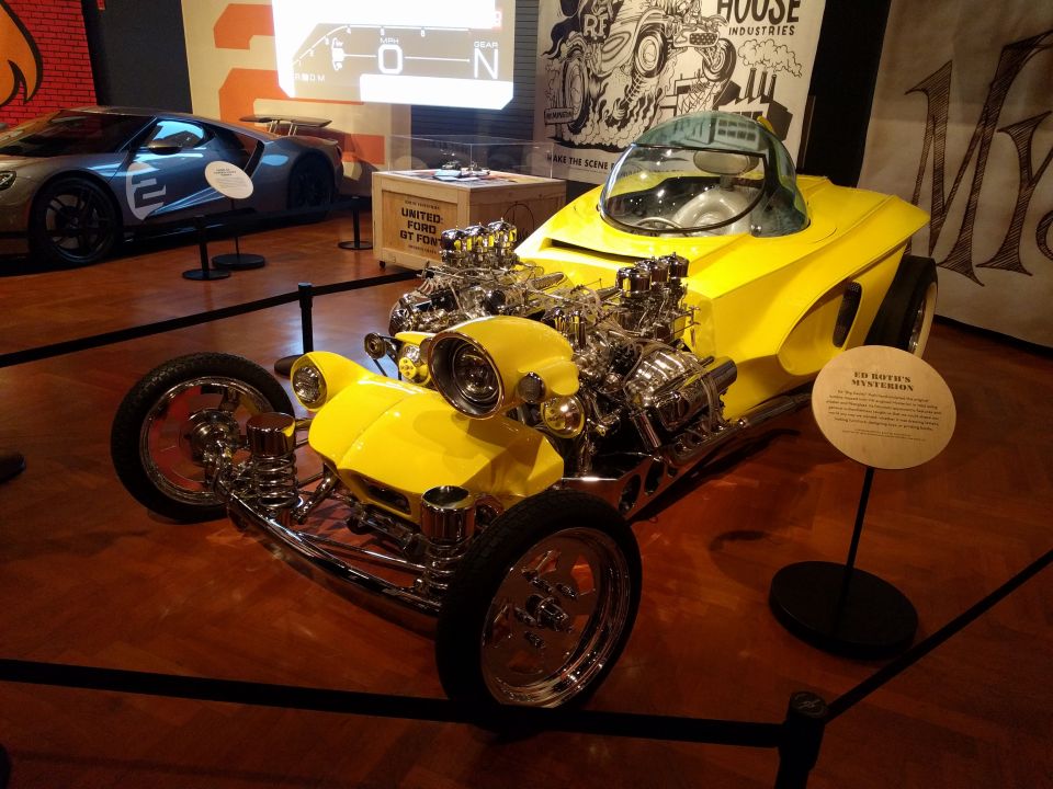 Yellow custom hot rod with dual engines and bubble canopy