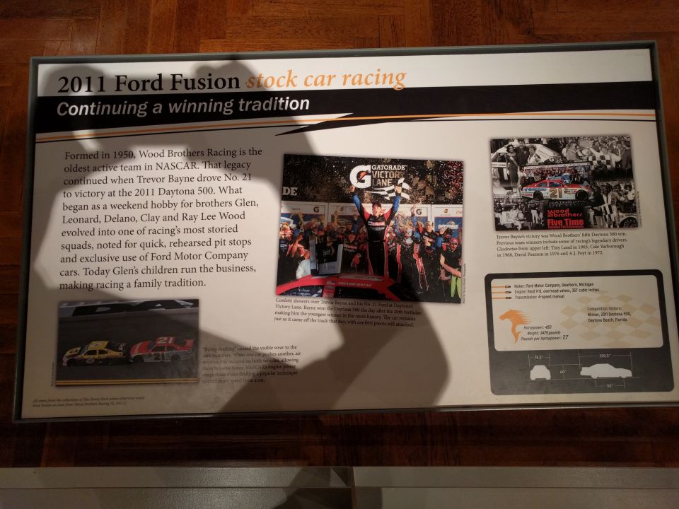 Display board about the 2011 Ford Fusion stock car and Wood Brothers Racing.