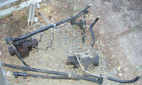 1992 Ford Bronco - 4-bolt steering boxes, '97 F150 w/ cooler on top, '99 E350 on bottom.