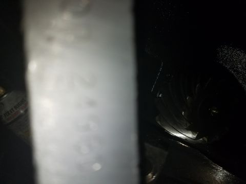 1996 Ford Bronco - Close-up of a vehicle's interior door panel showing some smudged writing.