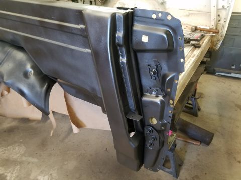 1996 Ford Bronco - Close-up of a car door's inner workings, showing structural components and hardware.