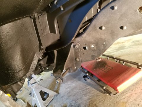 1996 Ford Bronco - Vehicle frame and suspension components are visible, supported by jack stands.
