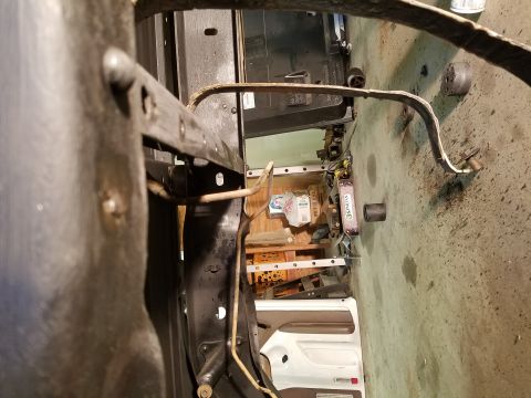 1996 Ford Bronco - The interior of a vehicle is visible, focusing on the door panel and dashboard area.
