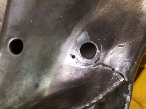 1996 Ford Bronco - This is a close-up view of a metal component showing signs of damage, including a significant crack.