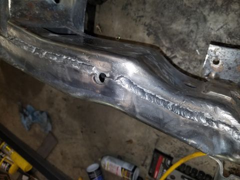 1996 Ford Bronco - The vehicle frame shows extensive welding repairs and modifications.