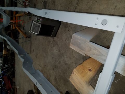 1996 Ford Bronco - A vehicle frame, possibly from a 1996 Ford Bronco, is shown with a digital heater unit attached.