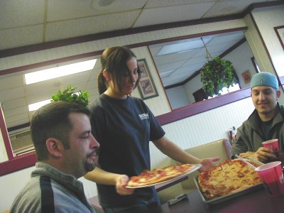1997 Ford Taurus - A waitress delivers pizzas to customers at a restaurant.